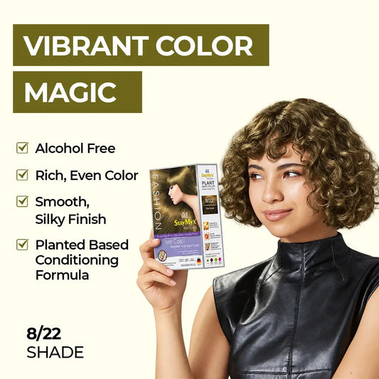 Model with short curly hair holding StayMyx 8/22 Olive Green hair color packaging, highlighting rich even color, silky finish, and conditioning formula.