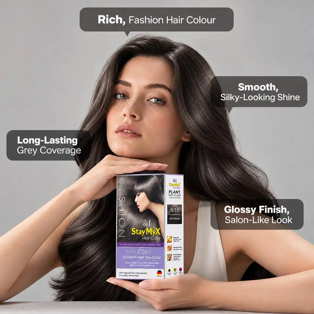 Model with long, glossy ash brown hair holding StayMyx 6/11 Plant Hair Color, highlighting long-lasting grey coverage, silky-looking shine and a salon-like finish.