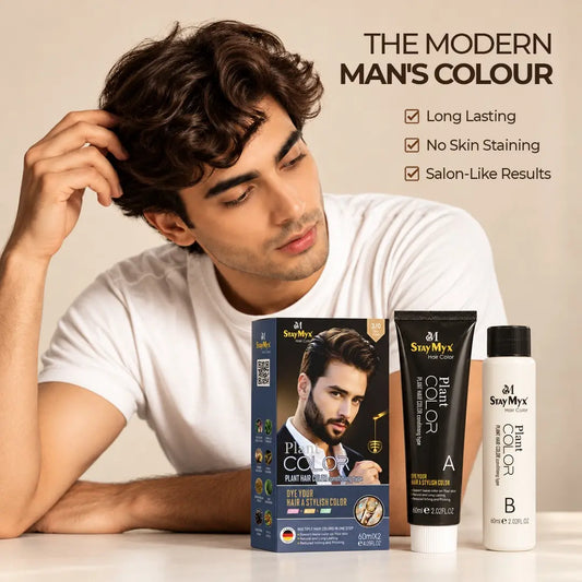Man with natural-looking curly brown hair showcasing a fresh hair color look with StayMyx men's hair color.